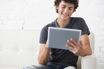 teen boy using a tablet 