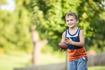 boy child with a football 