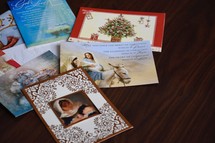 Christmas cards on a wood desk 