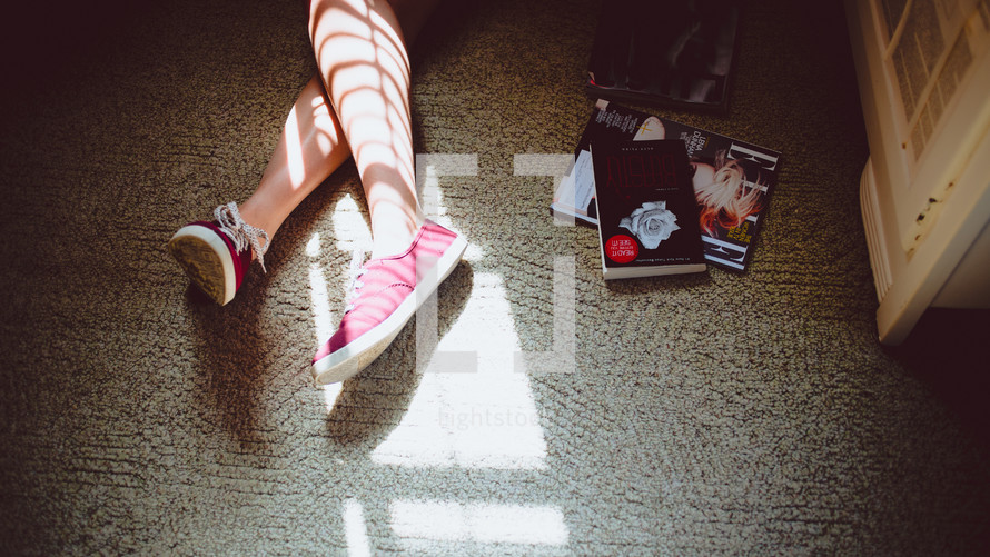 feet in sneakers and magazines 
