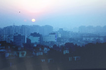 sunrise over a hazy city 