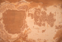 worn red clay wall 