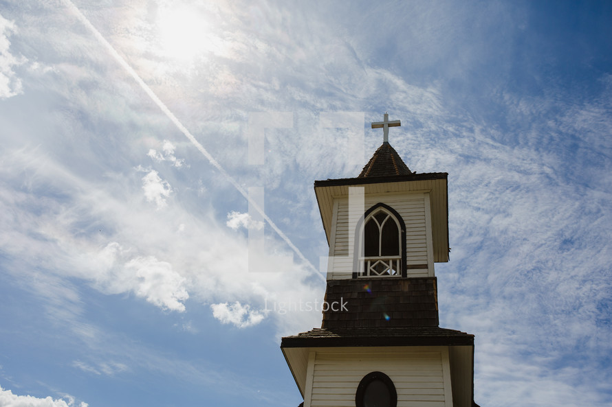 old wooden church steeple with cross