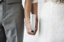 bride and groom holding a Bible together 
