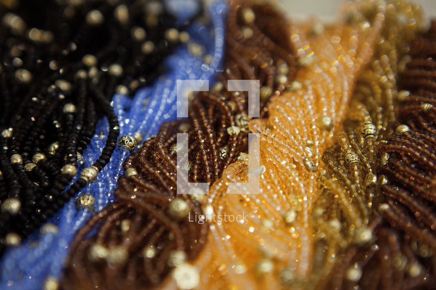 Beautiful beads on Shop-window. Fashion female accessories.