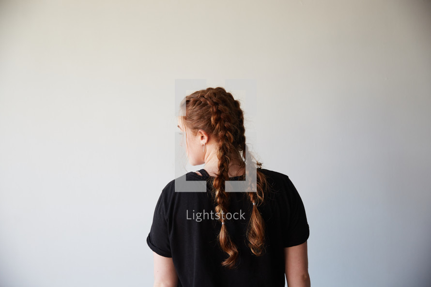 woman with braided pigtails 