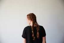 woman with braided pigtails 