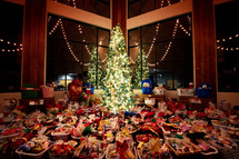 baskets of food around a Christmas tree 