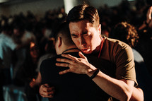 compassionate hug during a worship service 