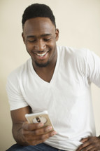 African American man texting 