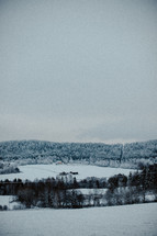 distant farm house in snow 