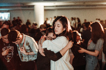 compassionate hug during a worship service 