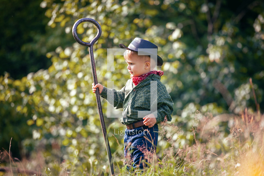 Cute Little Boy with Hat and Shepherd's Staff 