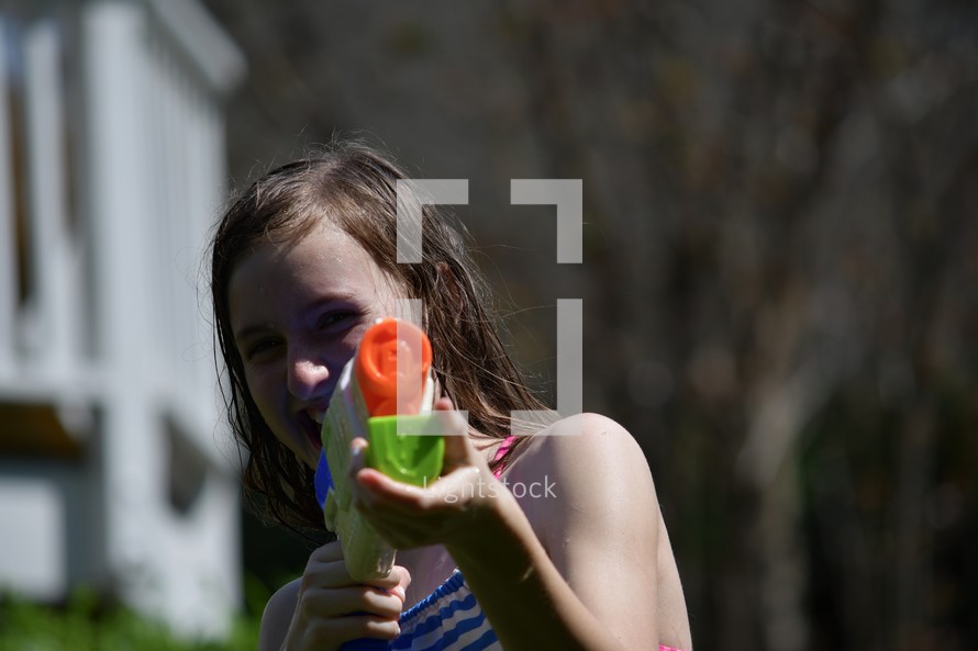 girl with a water gun 