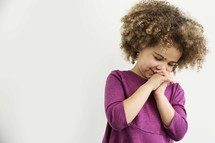 little girl in prayer.