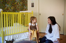 a mother and daughter in her nursery 