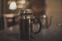 A french press brewing coffee