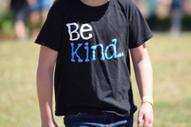 child wearing a Be kind t-shirt 