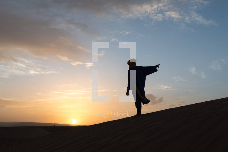 silhouette of a man in a desert 