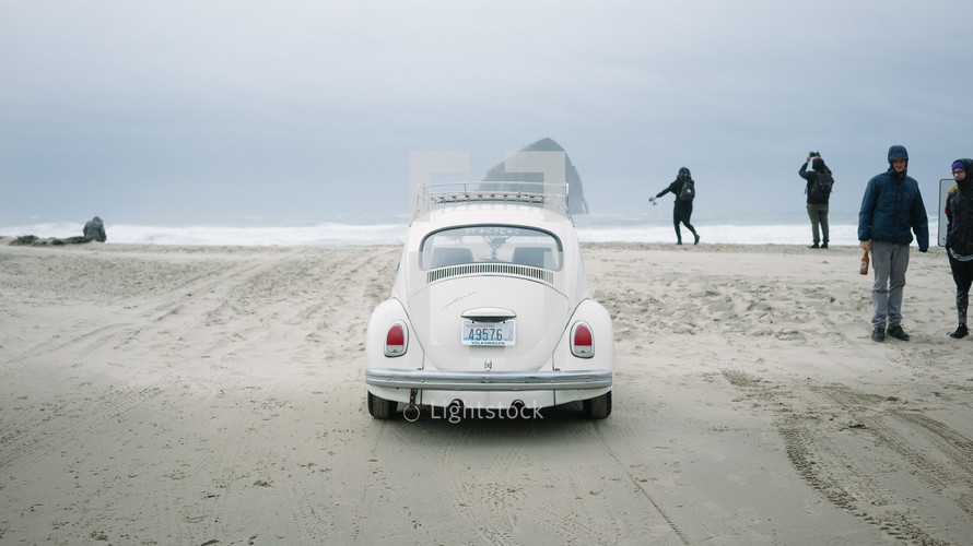 Volkswagen Beetle on the sand of a beach