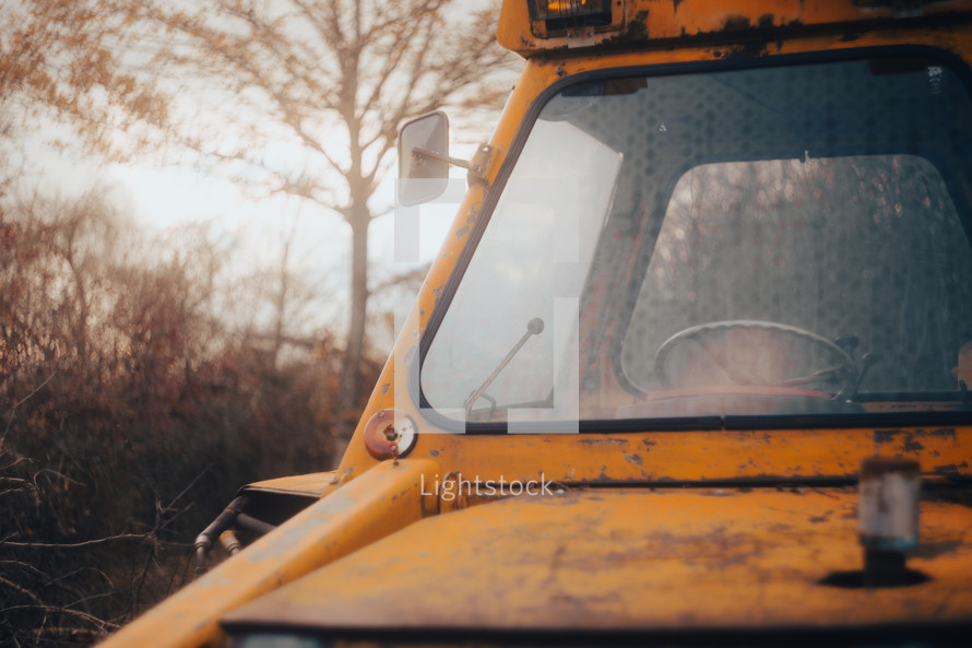 Digger tractor window windshield, heavy construction excavator machinery close-up