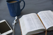 ipod, earbuds, open Bible, reading, podcast, coffee, coffee mug
