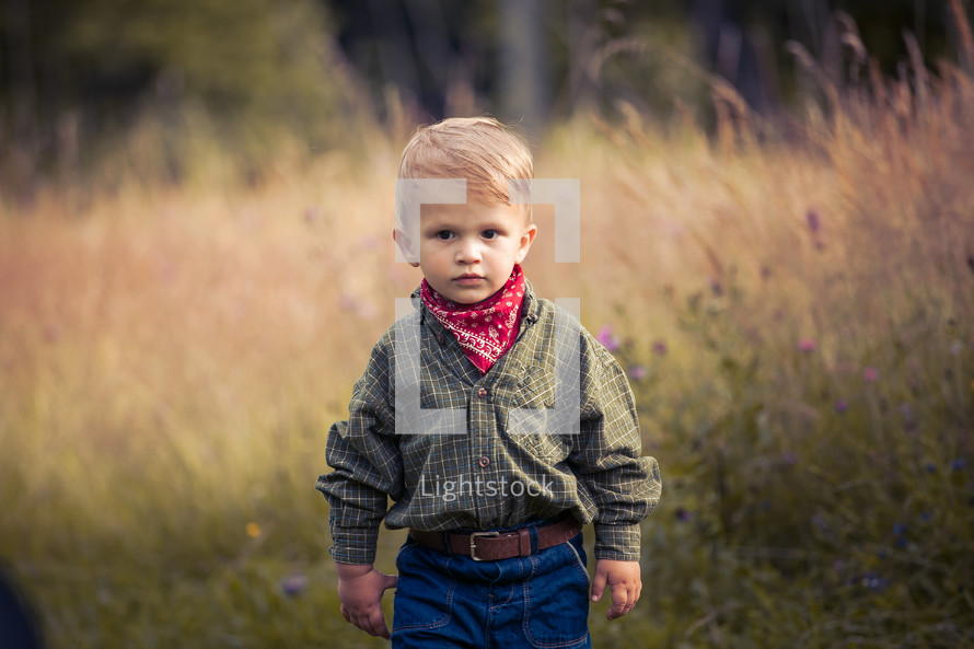 Cute Little Boy in Western Costume with Jeans and Bandana