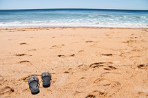 flip flops on the sand 