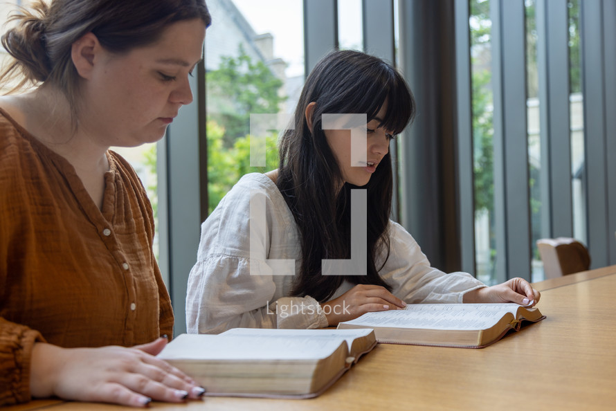 young women studying scripture 