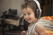 toddler listening to headphones