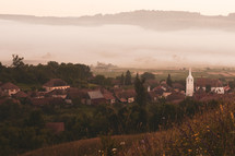 fog over a valley town 
