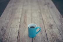 coffee mug and wood table