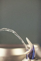 water flowing from a drinking fountain 