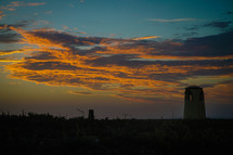 buildings on a shore at sunset 