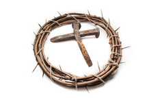 cross of nail spikes in the center of a crown of thorns 