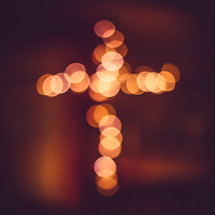 bokeh lights in the shape of a cross