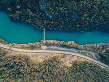 aerial view over river and forest and highway 