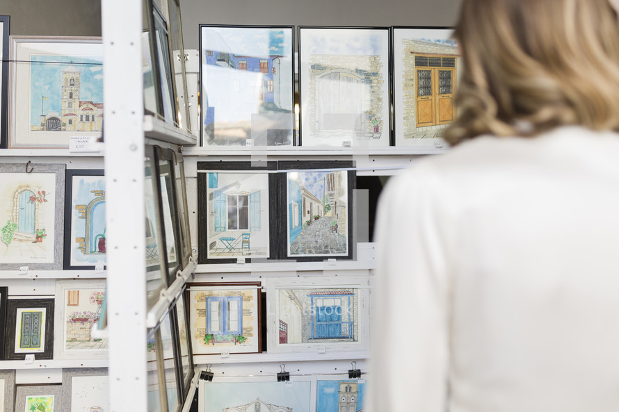 Woman looking at a picture gallery.