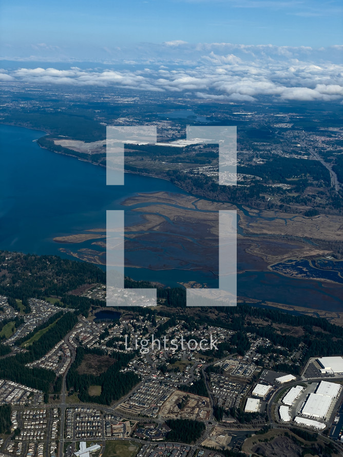 Aerial of city with clouds in the background