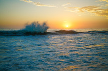 splashing waves at sunset 