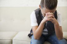 a boy child in prayer 