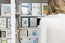 Woman looking at a picture gallery.