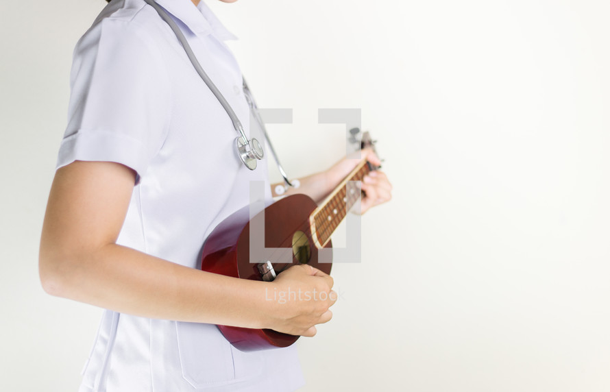  a healthcare worker holding a musical instrument 