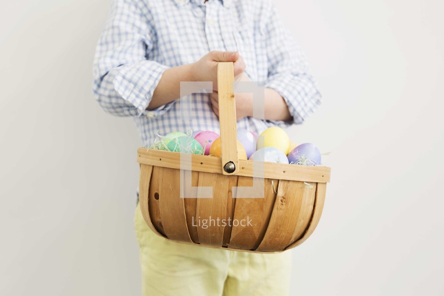 boy holding an Easter basket 
