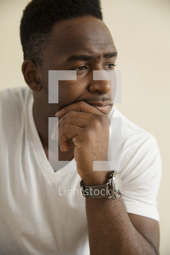 a young man in thought.