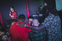praying over others during a worship service 