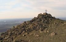 cross on a mountain peak - Cross View from Pricopan Peak in Macin Mountain