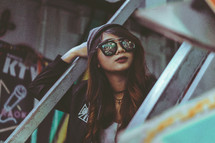 face of a teen girl in sunglasses 