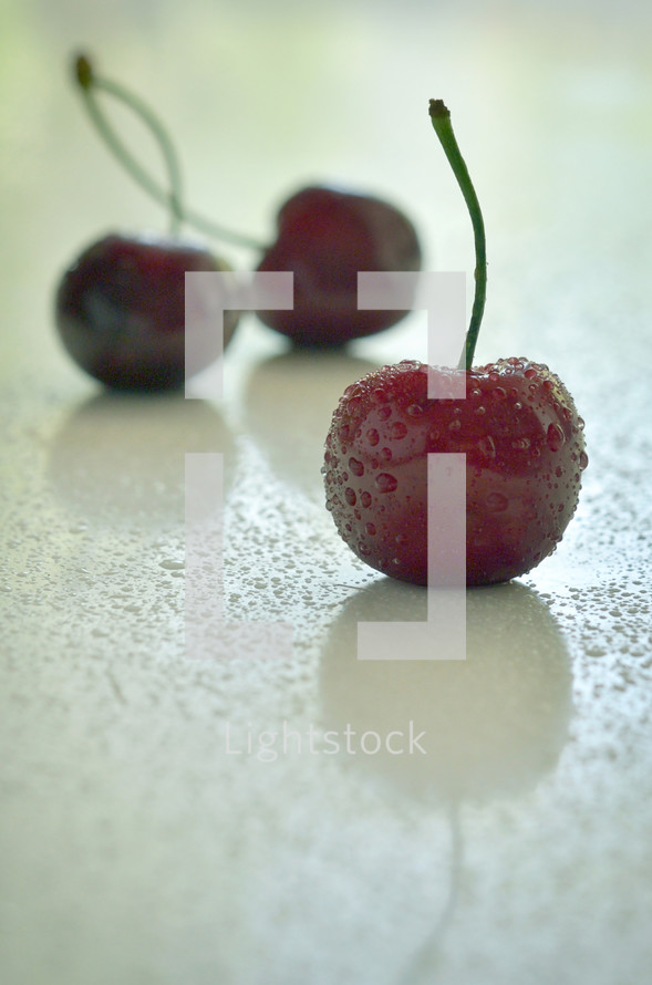 Closeup Cherry Fruits on Wooden Table and drops