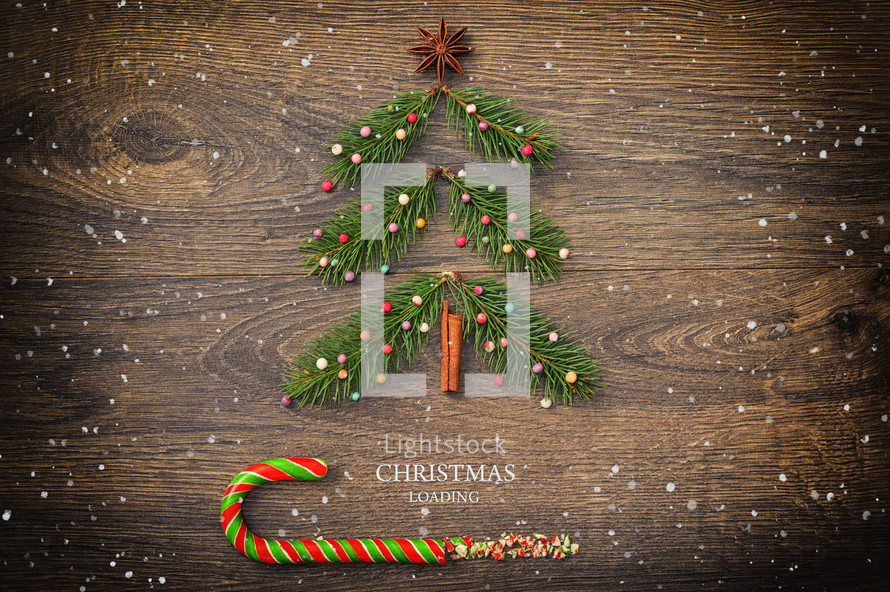 Conceptual Christmas Loading Over Wooden Background